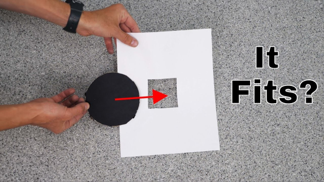 Thumbnail of the video from YouTube. Someone is holding a black cutout circle and a sheet of paper with a square hole in it that's much smaller than the circle he wants to pass it through, the text on the side reads "It Fits?"
