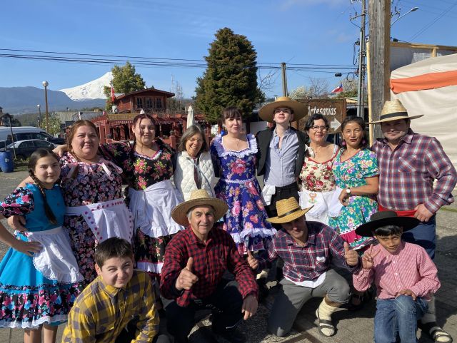 Picture with lots of Chileans wearing traditional dress and me in the middle. 