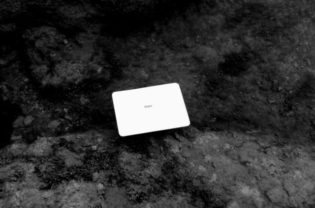 A black-and-white photo of an Oblique Strategy card. The card reads: 'Water'.