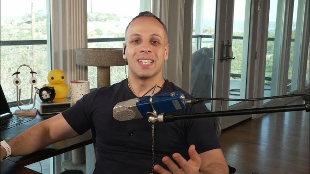 Thumbnail of the video from YouTube. You can see Louis Rossmann sitting on his chair with a microphone in front of him, he is smiling and gesturing something with his hand.