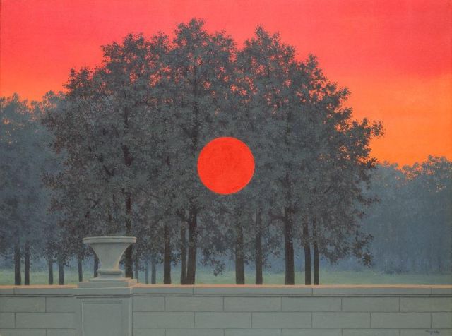 The Banquet, by Rene Magritte. A blazing red sky at sunset is the backdrop behind a dusky glen of trees, and beyond, a darkening forest. We seem to be on a formal patio, on one side of a stone wall in the foreground cutting across the entire bottom of the image, with a decorative stone urn disrupting the horizontal plane. At the center of the canvas is a brilliant red-orange circle, brighter even than the sky. It hovers curiously over the landscape. Why? No one knows.
